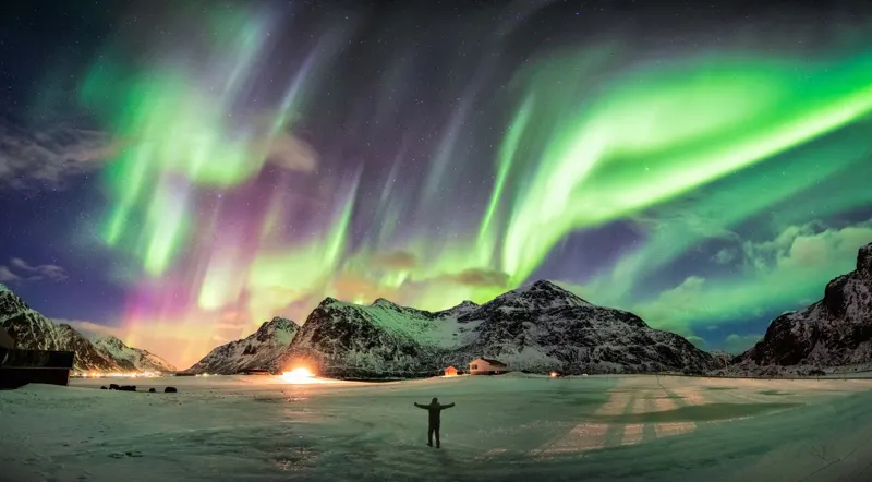 Illustration of the northern lights over an Icelandic landscape